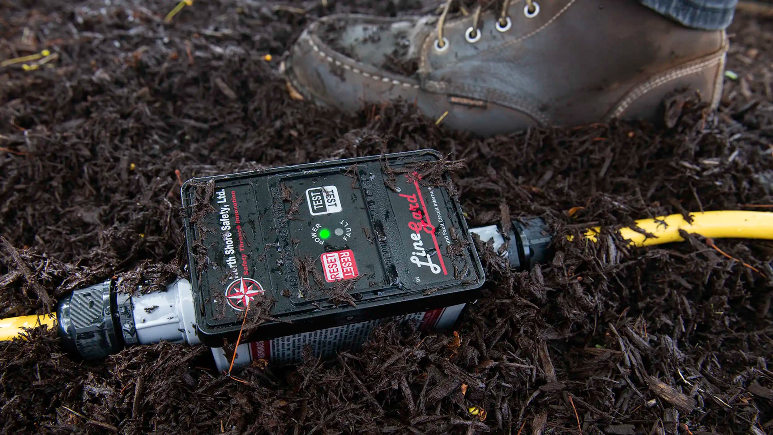 image of North Shore Safety 30 amp GFCI in wet soil